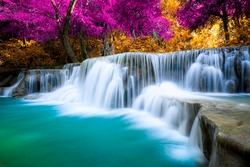 Amazing waterfall in colorful autumn forest