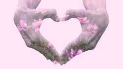 Double exposure of heart forming hands and flowers