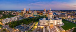 Aerial panorama of Providence skyline and Rhode Island capitol building at dusk. Providence is the capital city of the U.S. state of Rhode Island. Founded in 1636 is one of the oldest cities in USA.