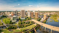 Aerial view of Richmond, Virginia, at sunset. Richmond is the capital city of the Commonwealth of Virginia. Manchester Bridge spans James River