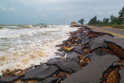 Road damage caused by sea waves erode