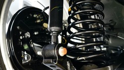 Automotive shock absorbers and springs installed in cars.