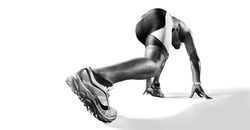 Sports background. Runner on the start. Black and white image isolated on white. Back view. Low angle.