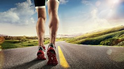 Sports background. Runner feet running on road closeup on shoe.