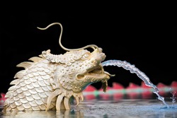 Statue of Chinese dragon fish out of water.