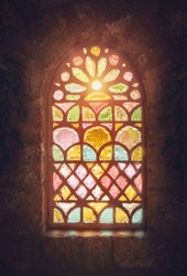 Stained glass window, amazing colorful window of an ancient church, house of god, place of worship, old ancient cathedral of Lebanon