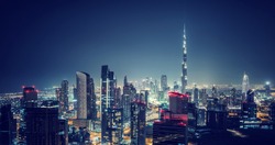 Beautiful Dubai cityscape, bird's eye view on a night urban scene, modern city panoramic landscape, United Arab Emirates