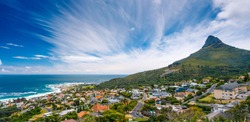 Camps Bay and Lion's Head mountain, amazing panoramic landscape of a coastal city, part of a Table Mountain National Park, Cape Town, South Africa