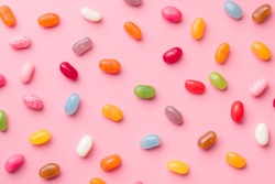 Sweet jelly beans on pink background.