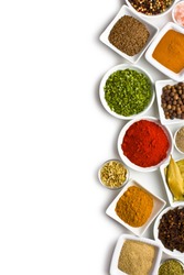 Various spices and herbs on white background.