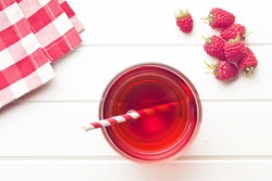 raspberry juice on white table