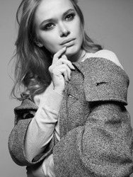 black and white portrait of Beautiful woman. Fashionable girl in coat