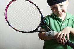 Smiling Little Boy Playing Tennis. Sport Children. Child with Tennis Racket