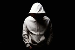 Man in Hood. Boy in a hooded sweatshirt. Face in shadow