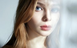 close-up portrait of beautiful young Woman. Sweet Girl in daylight from a window. beautiful female lovely Face