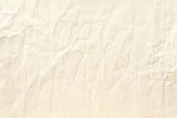 light yellow crumpled paper background texture 
