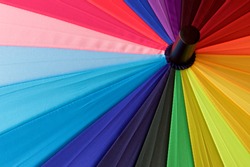 Multicoloured umbrella for a background.