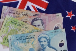 New Zealand flag and money together.