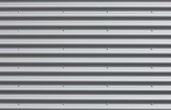 Corrugated iron wall with blanks.