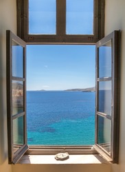 Open window overlooking the ocean. Stock image.