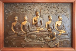 buddha metal copper carving.Mural paintings tell the story about the Buddha's history Buddha sculpture image. Asalha Puja Day. Buddhist All Saints' Day. Golden Buddha statue