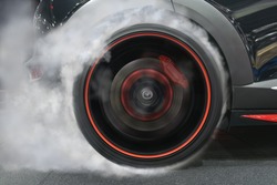 sport car wheel drifting and smoking on track dark edition 