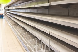 View of empty supermarket shelves, grocery store work stoppage closes, sanctions and embargo, panic buying with supplies and goods shortage, food crisis and deficit concept