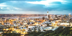 Auckland skyline from Mount Eden after sunset during blue hour - New Zealand modern city with spectacular nightscape panorama -  Enhanced filter on night lights