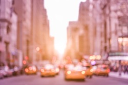 Rush hour with defocused yellow taxi cabs and traffic jam on 5th avenue in Manhattan downtown at sunset - Blurred bokeh postcard of New York City on a vintage marsala color filtered look