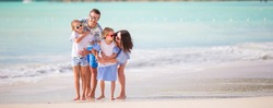 Happy family on a beach during summer vacation