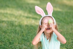 Adorable girl wearing bunny ears on Easter holliday