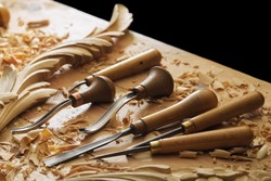 Woodworking tools. Carving wood with chisel. carpenter's hands use chiesel