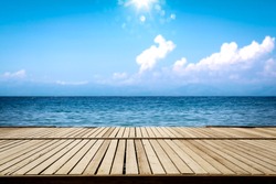 Summer wooden pier of free space for your decoration and ocean landscape with sky and sun light. 