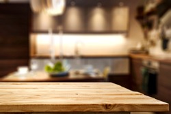 Wooden table background of free space and kitchen interior 