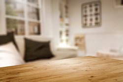 Corner of table with empty space for your product. Blurred home interior and christmas time. Copy space. 