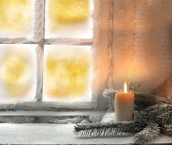 light of candle and window 
