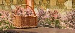 Empty wooden basket of free space for your decoration and spring flowers 