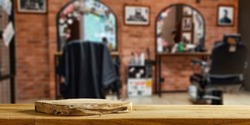 Desk of free space with wooden pedestal and barber shop interior. 