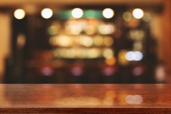 blurred background of bar and brown desk space 