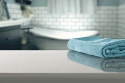 blue blurred background of bathroom interior with towel 
