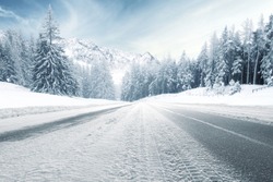 winter road and trees with snow and alps landscape 