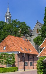 Half timbered house and church tower in Ootmarsum, Netherlands