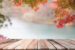 Empty wooden table with autumn background for product display montage