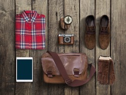 hipster clothes and accessories on a wooden background