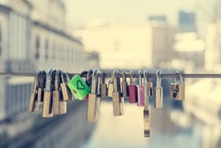 Green love lock over the river