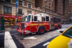 New York firefighter pumper truck responding to a emergency call in Manhattan downtown 