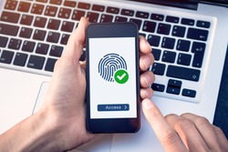 Secure access granted by valid fingerprint scan, cyber security on internet with biometrics authentication technology on mobile phone screen, person holding smartphone connected with wifi
