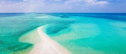 Sandbank beach for holidays vacation with white sand and turquoise blue transparent water. Aerial view from drone. Pristine tropical atoll island in Maldives. Abstract travel copy-space background.