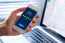 Person rating his experience with 4 stars on smartphone app screen, concept about online customer satisfaction feedback and quality evaluation of service, hotel or restaurant
