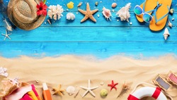 Beach Accessories On Blue Plank And Sand - Summer Holiday Background
